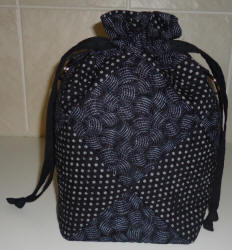 drawstring black quilted bag