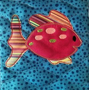 Fish applique combined with background quilting